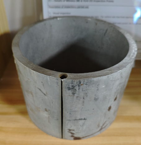 Large stainless steel ring section prepared for tensile test sampling